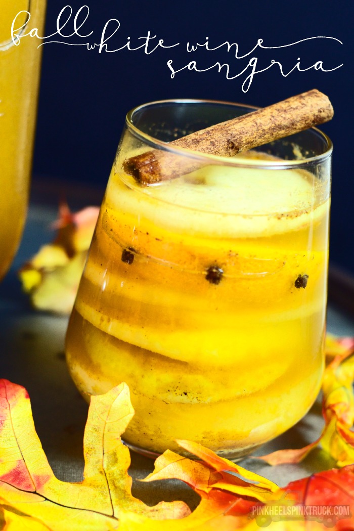 This White Wine Sangria Recipe is pure fall in a cup! All of your favorite fall flavors all melded together in an AMAZINGLY delicious white wine sangria!